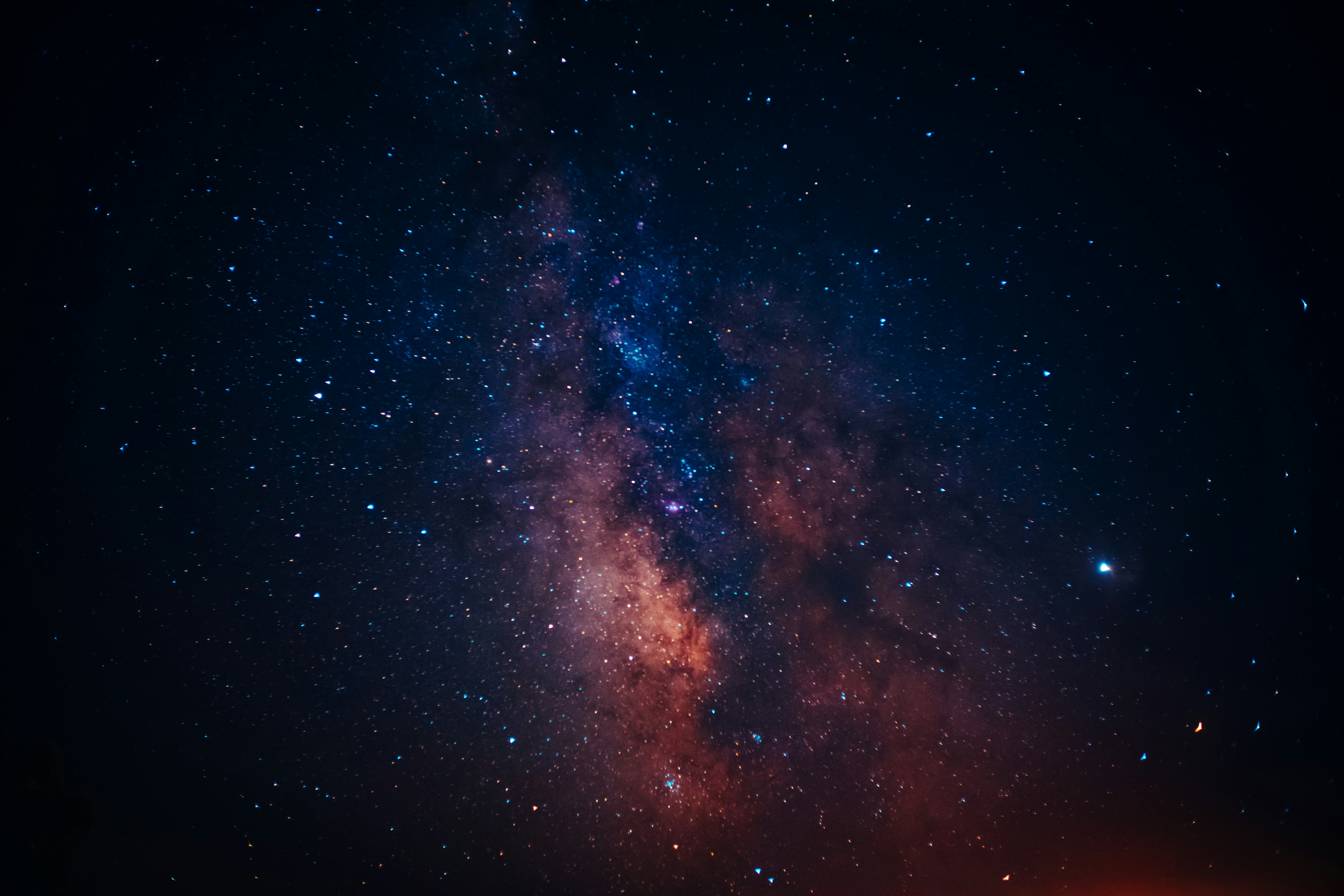 Photograph of space with stars and stardust.